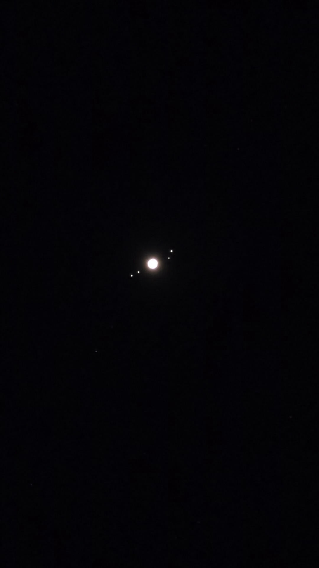 Jupiter and its 4 Galilean moons. You can actually see them all this time.