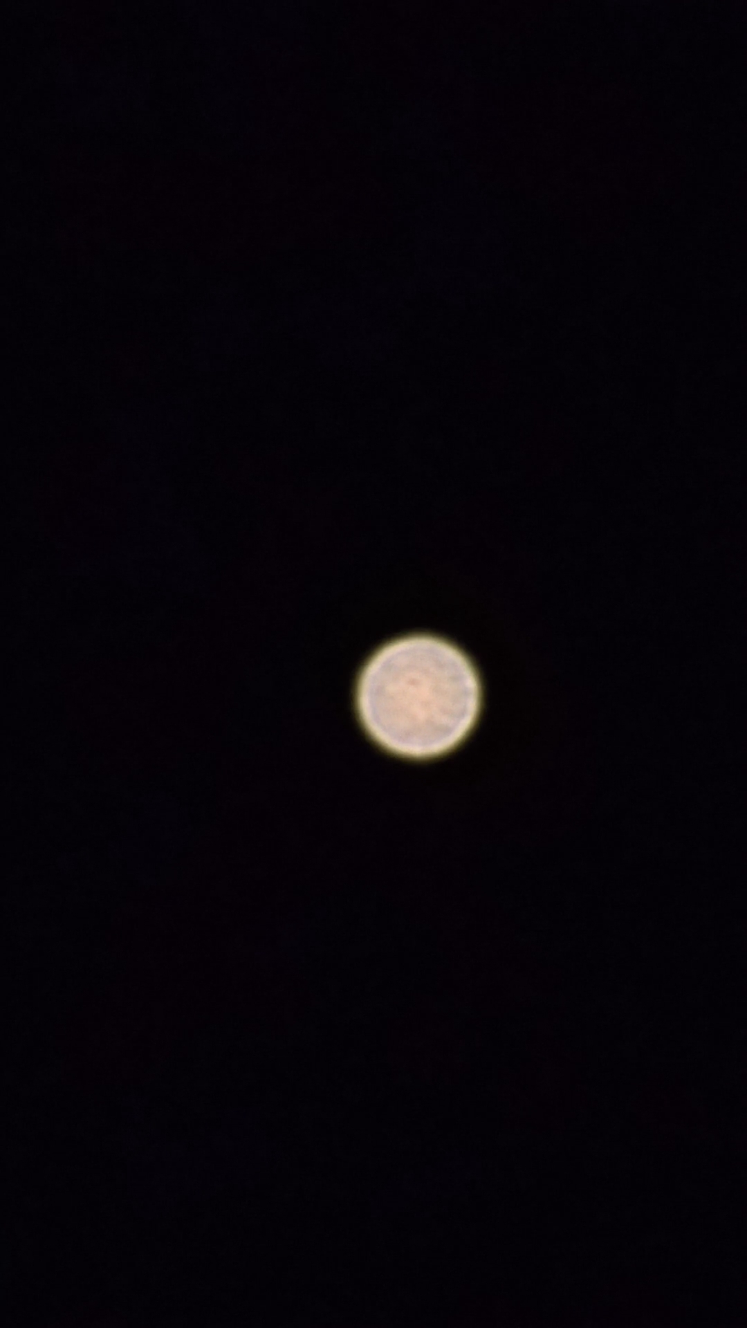 A poorly-focussed photograph of Mars.
